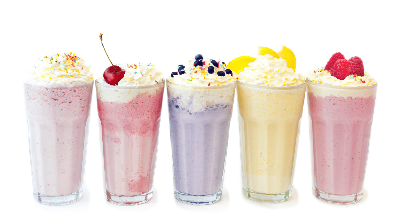 Multiple milkshakes in a line.